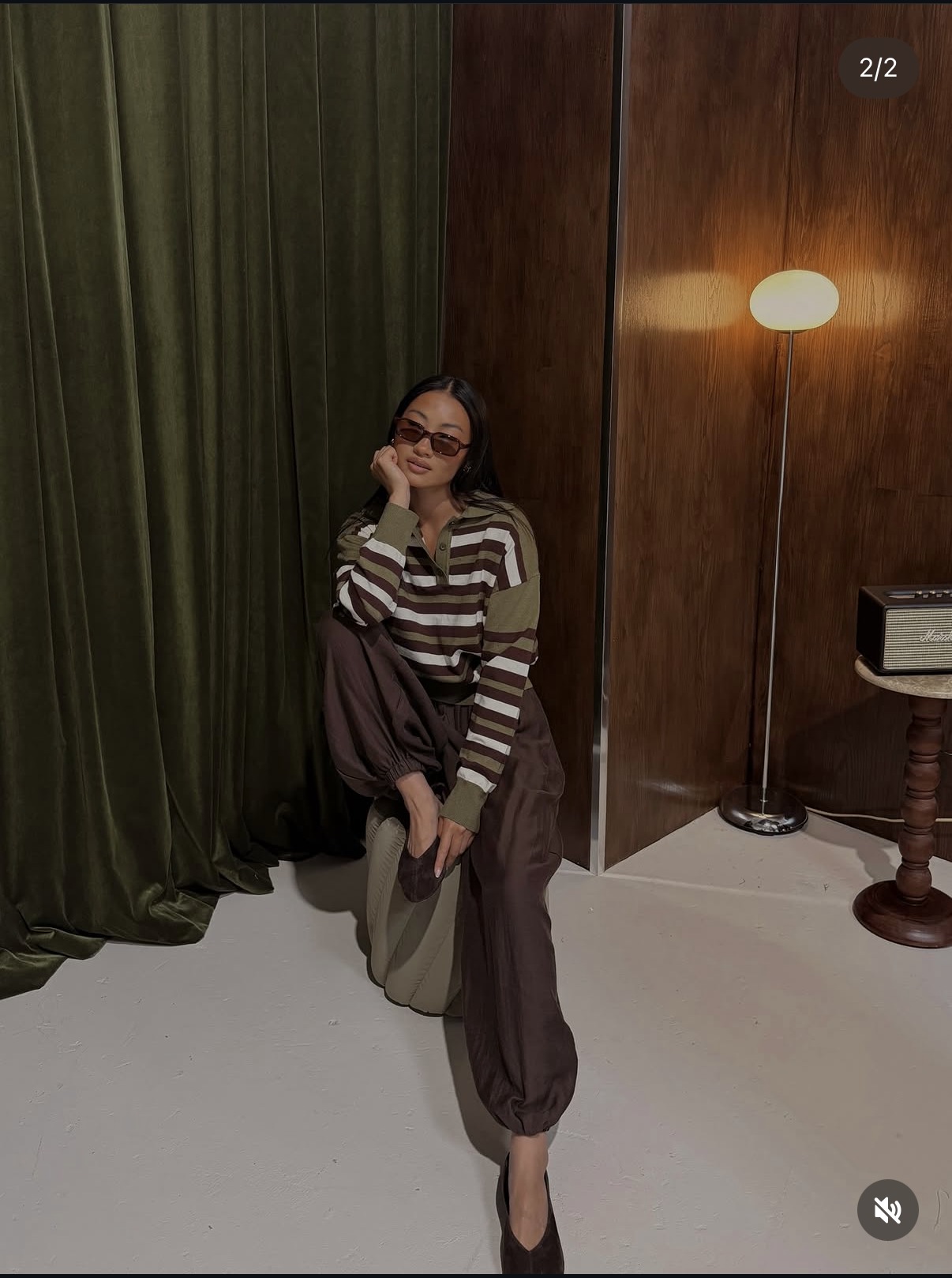 Styled autumn look against the studio backdrop.